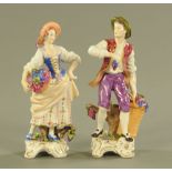 A pair of continental porcelain figures of grape harvesters. Height 18 cm.