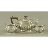 A three piece silver half lobed tea service, of small size, Birmingham 1902,