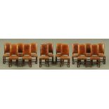 A set of fourteen leather upholstered dining chairs,