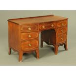 A 19th century mahogany bowfronted kneehole desk,