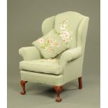 A large George III style wing easy chair,