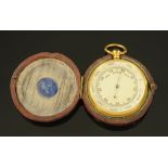 A 19th century leather cased pocket barometer. Diameter 51 mm.