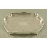 A silver plated galleried tray, of shaped outline. Length 57 cm, width 35 cm.