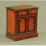 A 19th century miniature stained pine combined chest and cupboard. Height 34 cm, width 31.