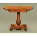 An early Victorian mahogany turnover top tea table, with well figured frieze, faceted column,