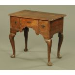 A George III oak lowboy, with rounded corners,