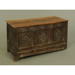 A late 17th century oak mule chest, with three panelled front and dated 1691 to the base drawer.