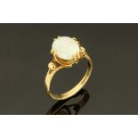 A 9 ct gold opal ring, Size K/L. CONDITION REPORT: Good condition with no issues.