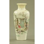 A Chinese vase, decorated with figures in a garden and with seal mark to base, lip restored.