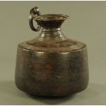 A 19th century Asian beaten copper curd pot. Height 38 cm.