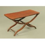 A 19th century mahogany folding low coaching table. Length open 92 cm, width 45 cm, height 48 cm.