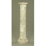 A marble column, with moulded lip and turned sections raised on a stepped base.