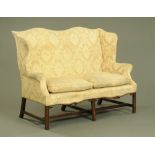 A George III style wing settee,