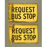 Two black and yellow enamelled request bus stop signs, 27.5 cm x 42.5 cm.