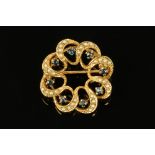 A 9 ct gold seed pearl and sapphire set circular brooch, diameter 28 mm, 4.7 grams gross.
