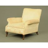 A Victorian Howard style stuffover armchair,