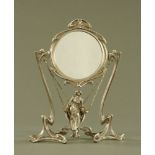 An Art Nouveau style girl on swing metal mirror frame, stamped to the rear Erte Paris.