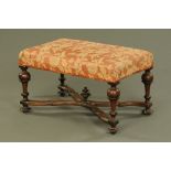 An 18th century walnut stool,