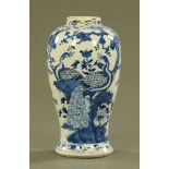 A 19th century Chinese Peacock patterned vase, blue and white with four character mark to base.