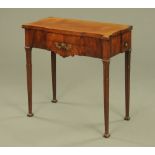 An early 19th century French turnover top combination table, with double turnover top, breakfront.