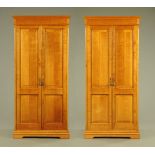 A pair of oak wardrobes,