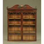 A Regency mahogany bookcase top,