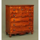 A Victorian mahogany Scotch chest of drawers with ripple moulded edge above a series of crossbanded