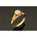 A 9 ct gold ring with single clear stone, Size M.