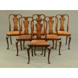 A set of six Queen Anne style walnut dining chairs, with shaped splat backs,