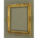 A 19th century gilt moulded and swept picture frame by J.