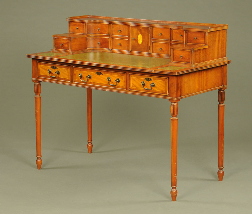 A Carlton House style desk, reproduction with green tooled leather writing surface,