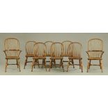 A set of two carver arm and six single Windsor style dining chairs, of large form,