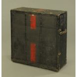 A large metal bound and canvas covered travel trunk. Height 32 cm, width 82 cm, depth 84 cm.