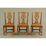 Three George III country oak Chippendale style splat back dining chairs,