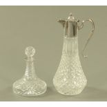 A moulded glass claret jug, with silver plated mount and a silver mounted small ships type decanter.