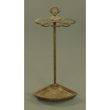 A late Victorian corner stick stand, cast iron with integral drip tray. Height 67 cm, width 32 cm.
