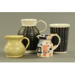 A Victorian ironstone china jug, of faceted form, two pieces of Denby stoneware and a milk jug.