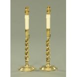 A pair of brass barley sugar twist table lamps, raised on circular bases. Height 46.5 cm overall.