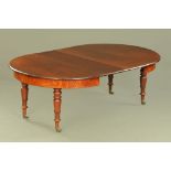 A William IV mahogany circular dining table with two extra leaves,