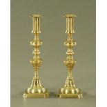 A large pair of Victorian polished brass candlesticks. Height 30 cm.