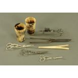 A pair of horn beakers, three grape shears, snuffers, glove stretchers etc.