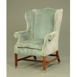 A George III style mahogany framed wing easy chair,