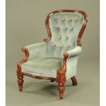 A Victorian style mahogany framed gentleman's armchair,