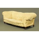 A Victorian Chesterfield settee, deep buttoned, drop arm,