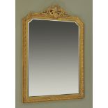 A 19th century style gilt painted wall mirror, with foliate scrolling pediment,