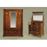 An Arts and Crafts inlaid mahogany wardrobe and dressing table to match,