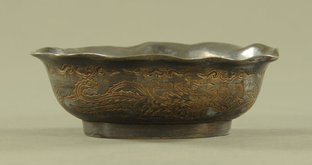 A Chinese bronze dish, decorated with dragons and with character mark to base. Length 15 cm. - Image 2 of 3