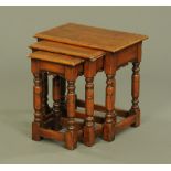 A nest of three 18th century style oak occasional tables,