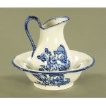 An ironstone blue and white transfer printed toilet jug and basin, basin diameter 31 cm.