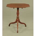 A Georgian mahogany tripod table, with canted angles, turned column and downswept moulded legs.